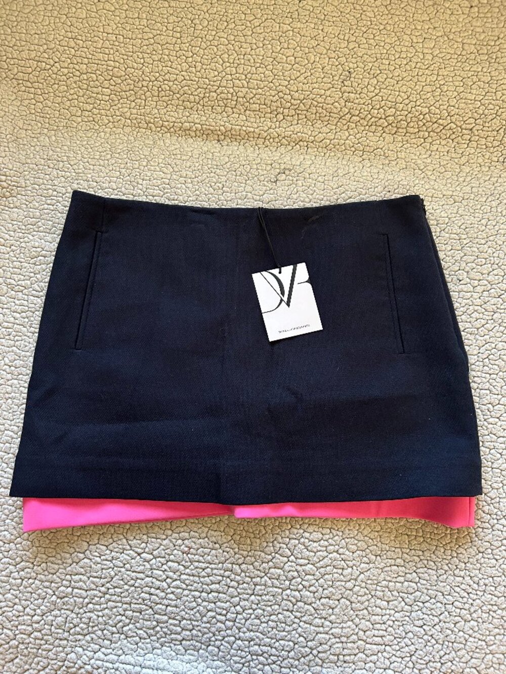 Diane Von Furstenberg -- dark navy mini skirt with hot pink under layer